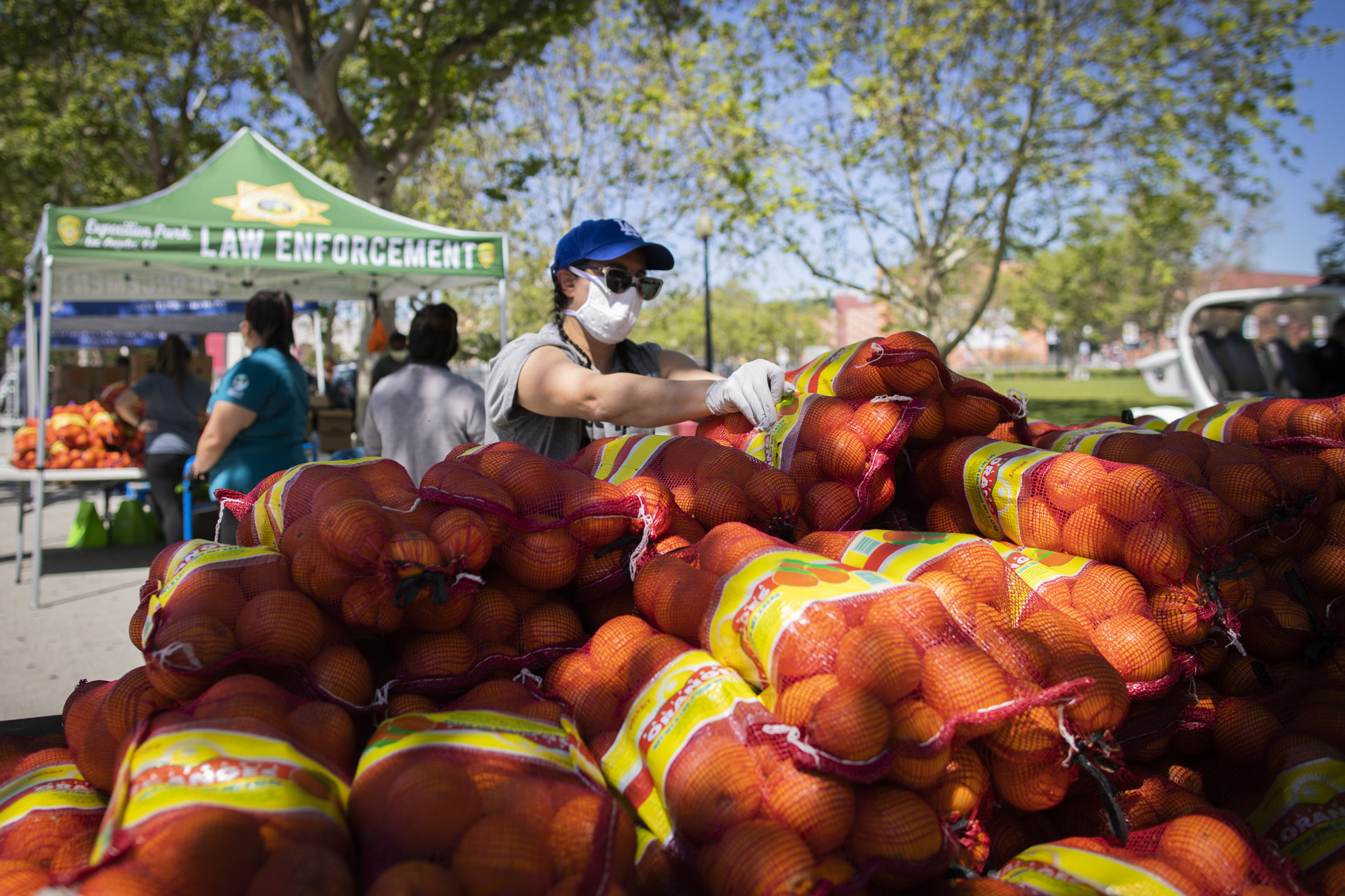 Elizabeth Bowman, Director of Farmers Market Operations for Sustainable Economic Enterprises of Los Angeles (SEE-LA) helps with the Farm Box Program.