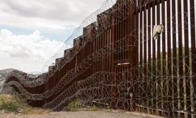 The US/Mexico border fence in Nogales, Arizona.