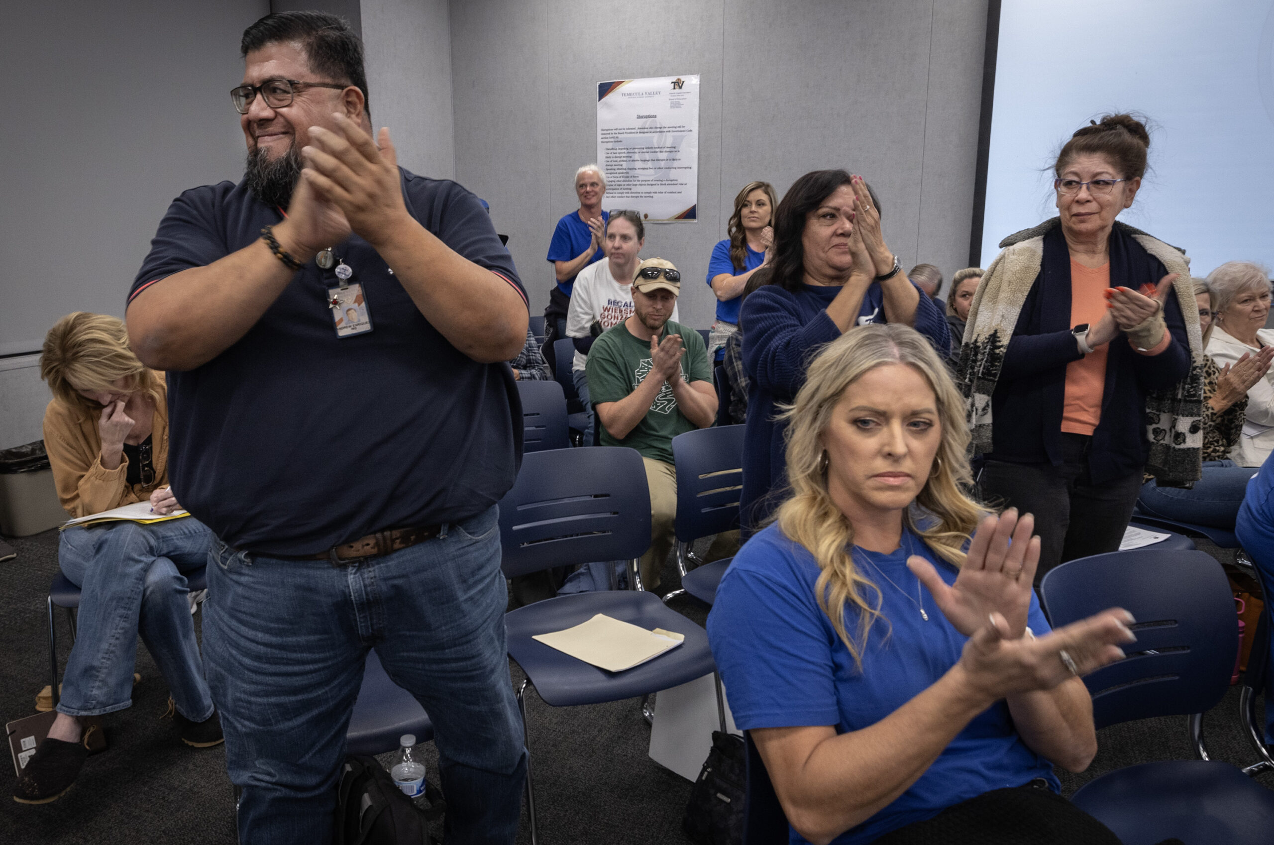 Supporters who favor the recall cheer on speakers presenting their case to remove three of the far right trustees during a school board meeting in Temecula on Nov. 14.