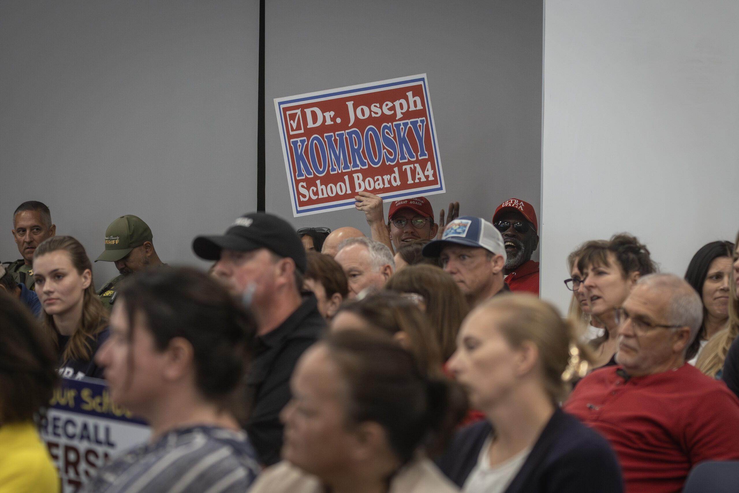 Supporters of Joseph Komrosky, president of the school board and one of three trustees who are in jeopardy of being recalled, attend a school board meeting in Temecula on Nov. 14.