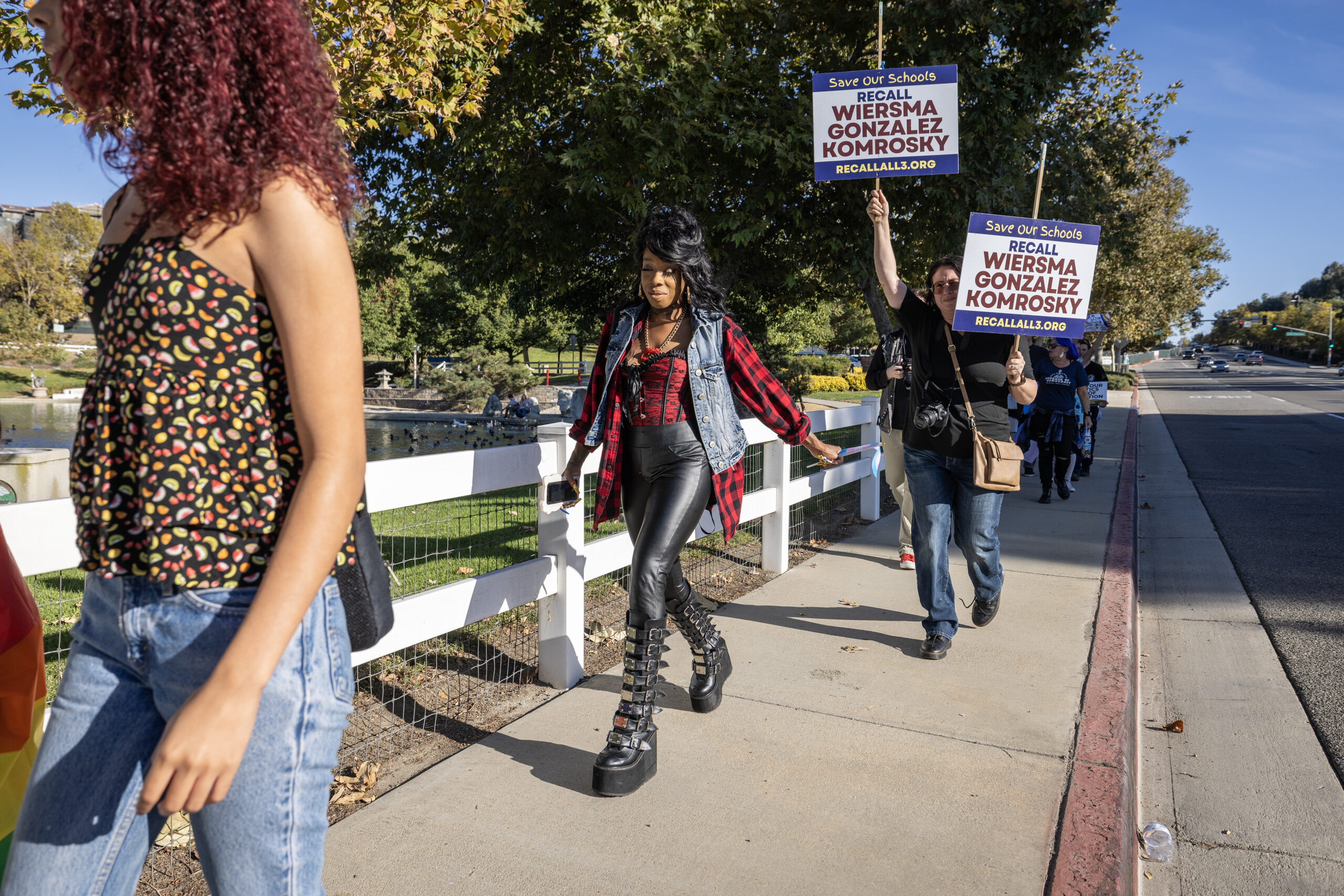 Student Brooklyn Anderson and her mother Shayla Anderson march along a street during a rally against homophobia in Temecula.